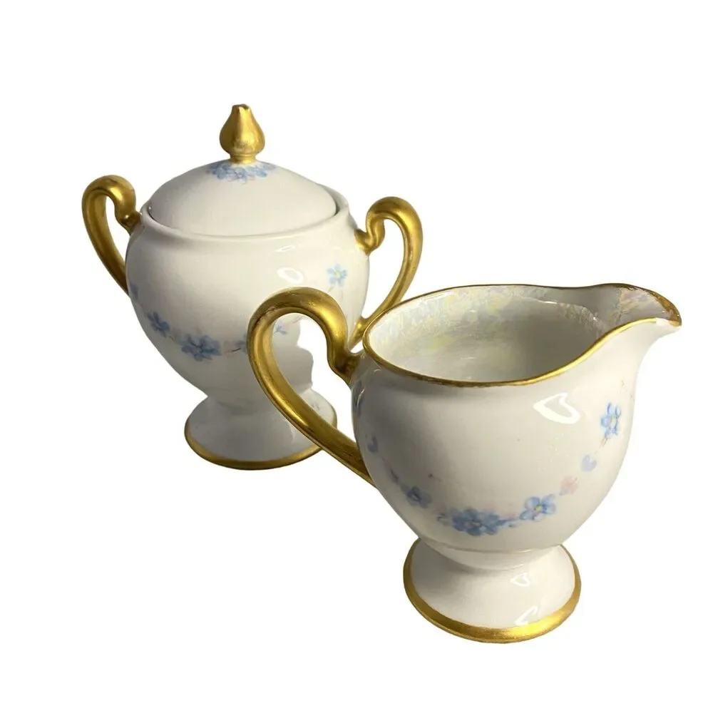 #8191 VINTAGE MADE IN JAPAN SUGAR BOWL AND CREAMER WITH LIGHT BLUE FLOWERS